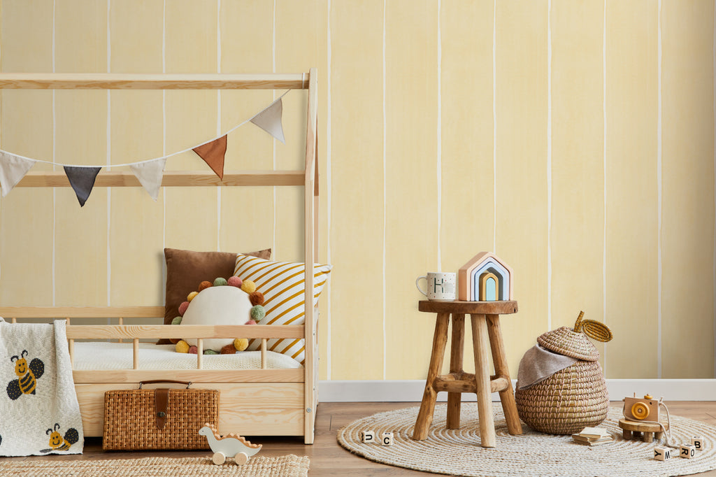 The Painted Awning wallpaper in pale primrose behind a kids' play corner