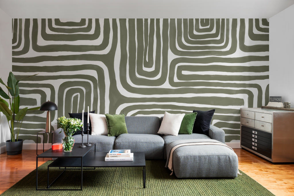 The Painted Labyrinth mural in olive and cream in a living room
