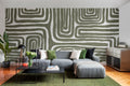 The Painted Labyrinth mural in olive and cream in a living room