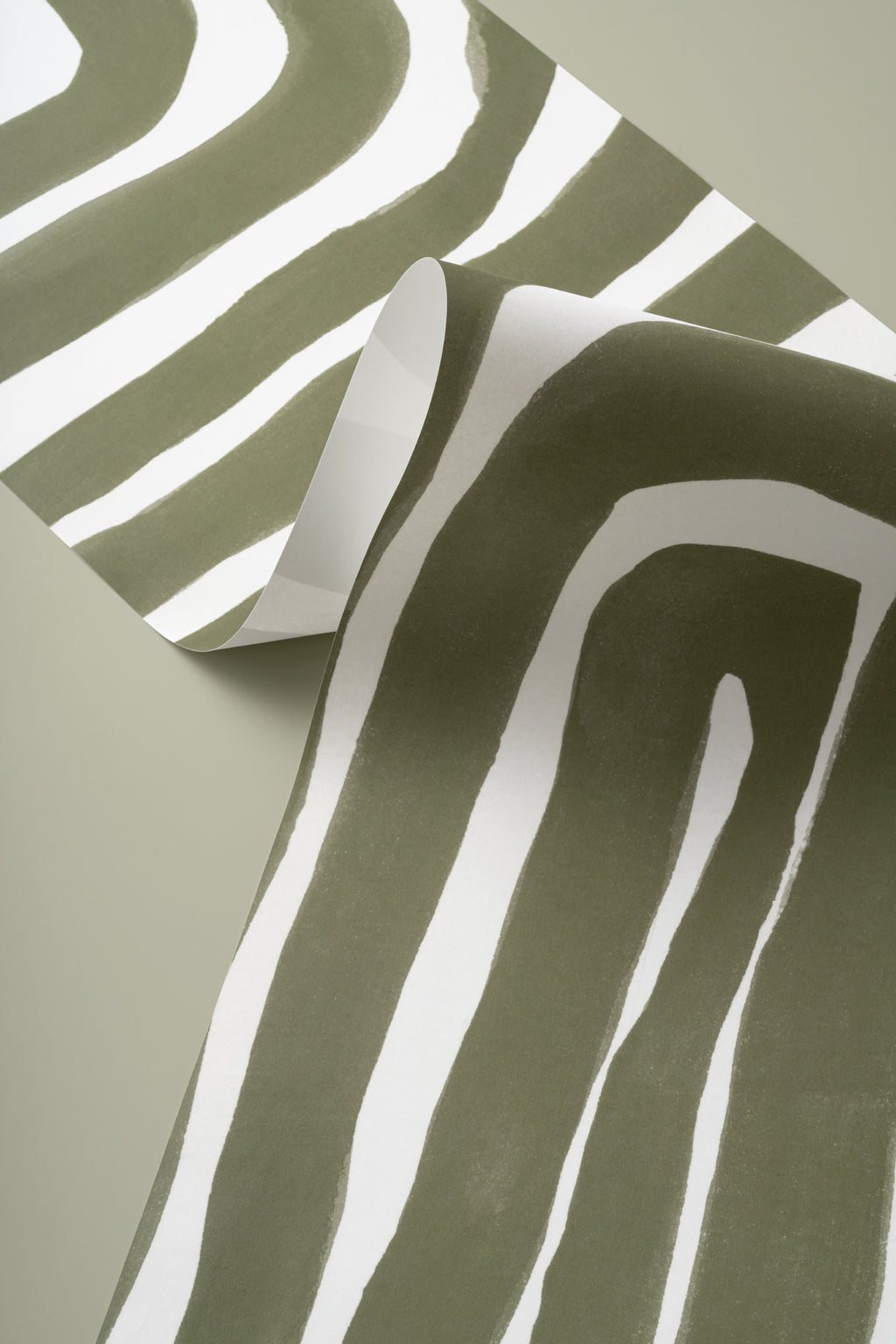 Angled detail of The Painted Labyrinth mural in olive and cream