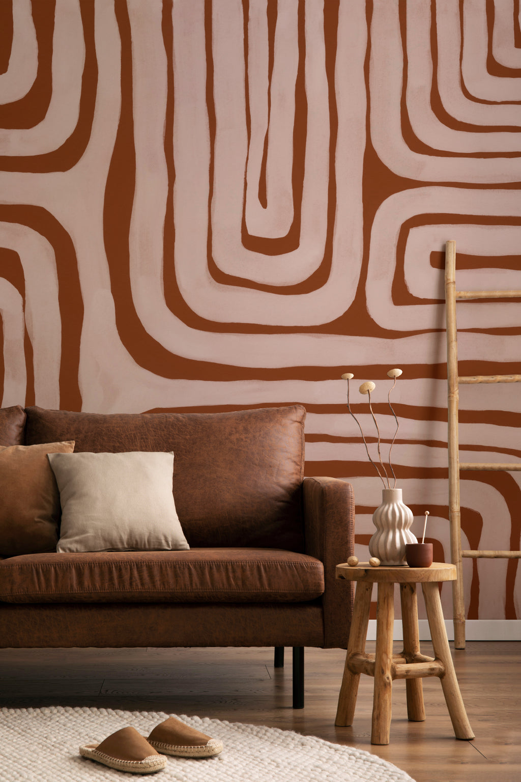 The Painted Labyrinth mural in terracotta and rose in a calm bedroom setting