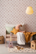 The Painted Tiling wallpaper in powder pink in a child's bedroom