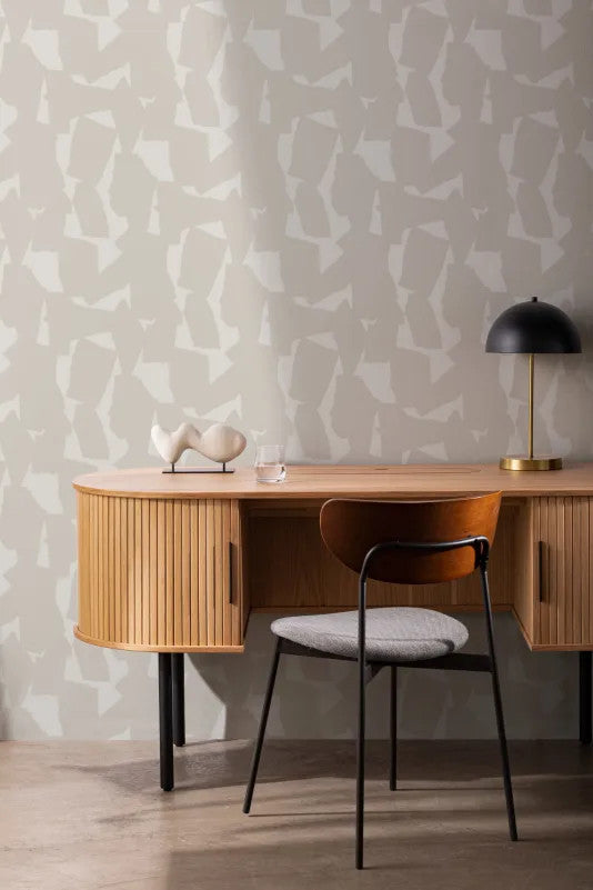 The Paper Mosaic wallpaper in oat beige behind a desk in a home office