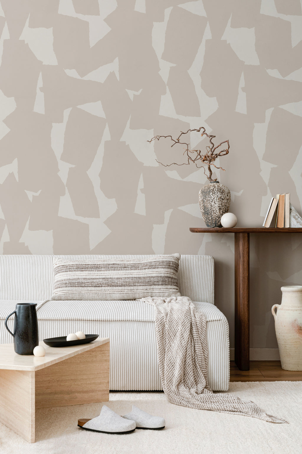 The Paper Mosaic wallpaper in oat beige behind seating in a living room