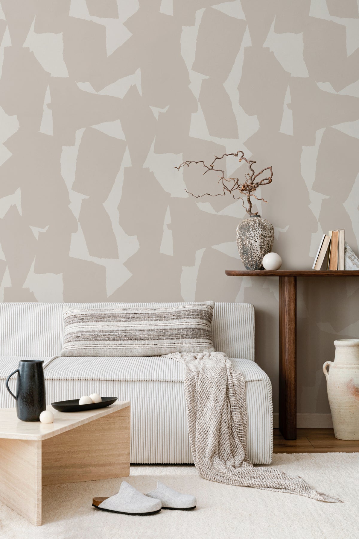 The Paper Mosaic wallpaper in oat beige behind seating in a living room