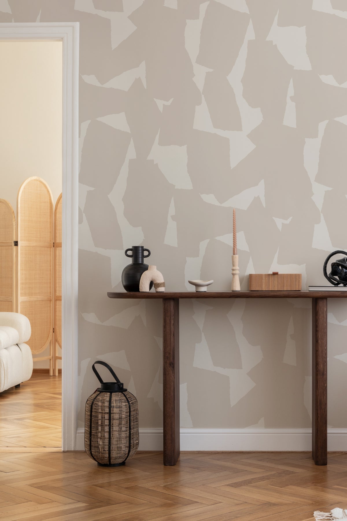 The Paper Mosaic wallpaper in oat beige as a backdrop to styled furniture