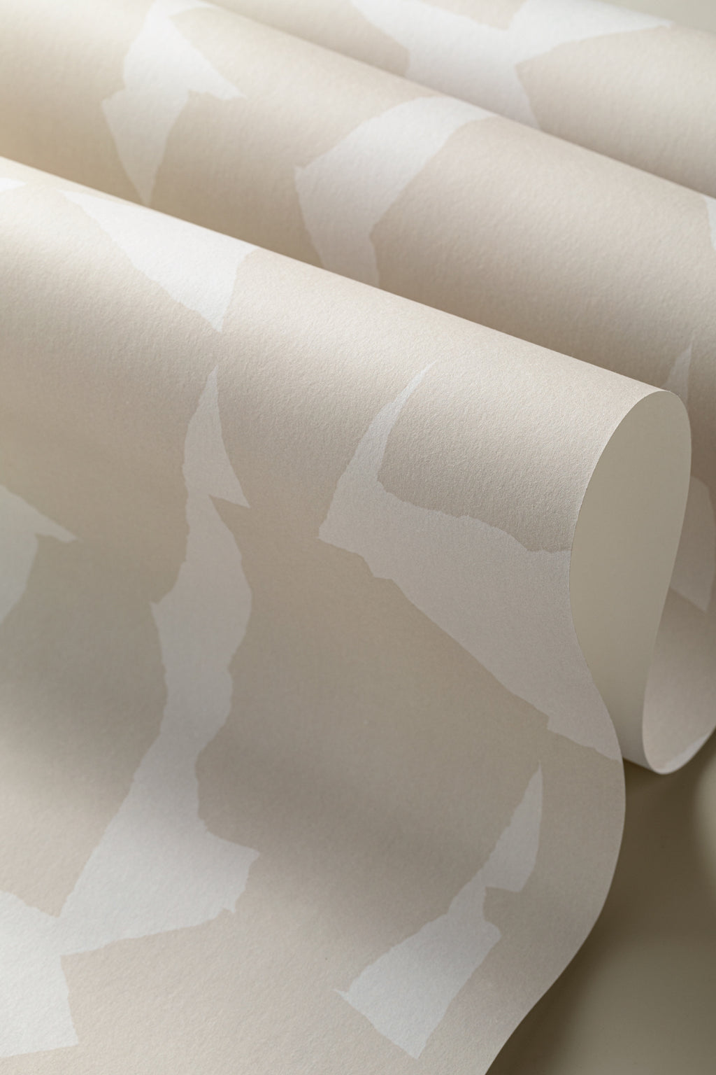 Angled detail of The Paper Mosaic wallpaper in oat beige