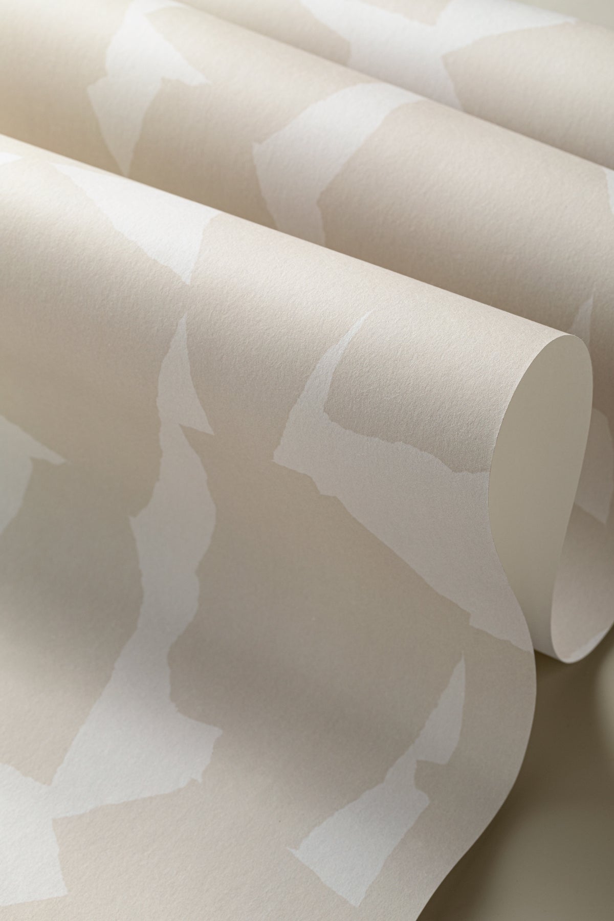 Angled detail of The Paper Mosaic wallpaper in oat beige