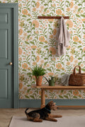 The Pavilion Garland wallpaper in marigold and leaf green in a hallway