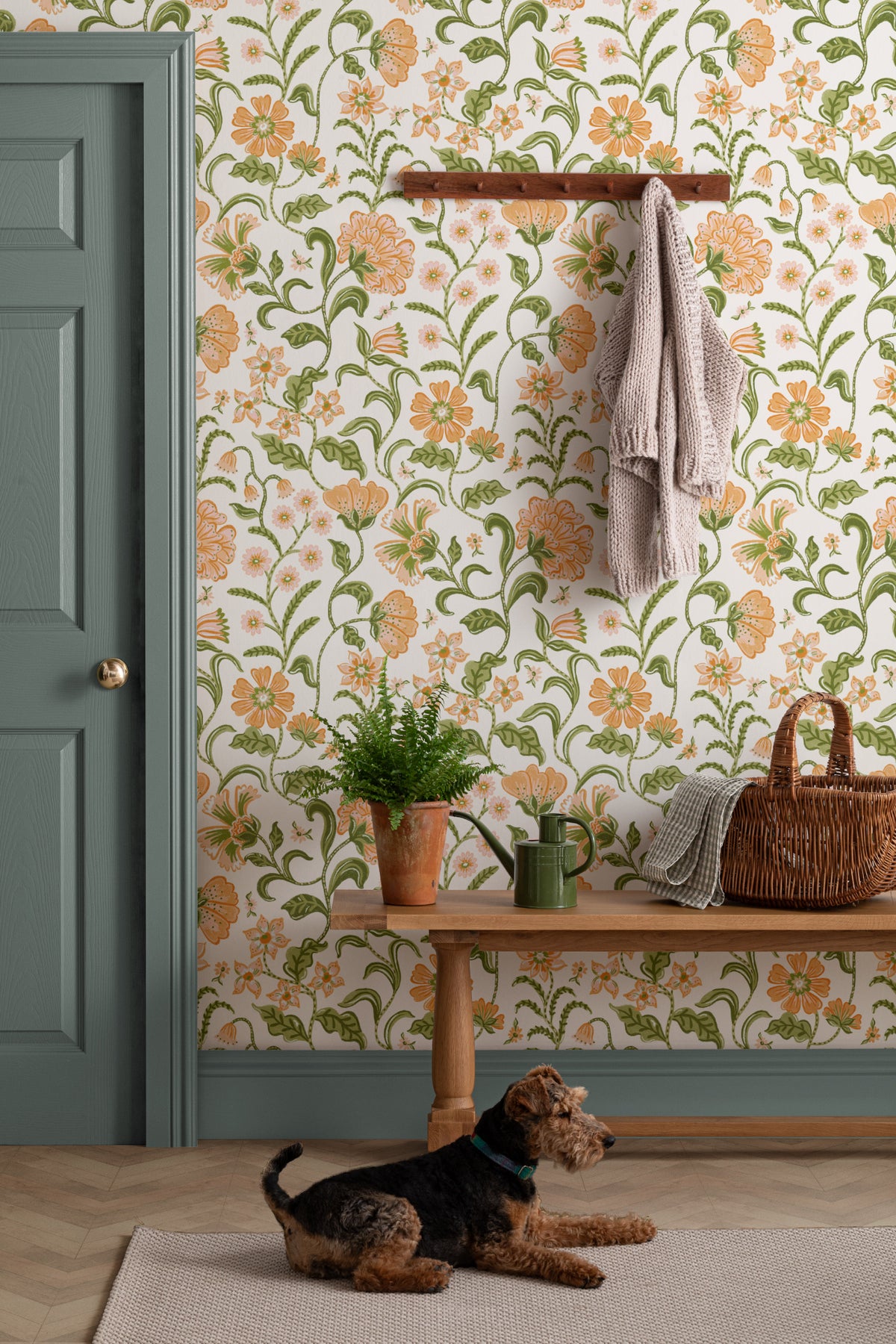 The Pavilion Garland wallpaper in marigold and leaf green in a hallway