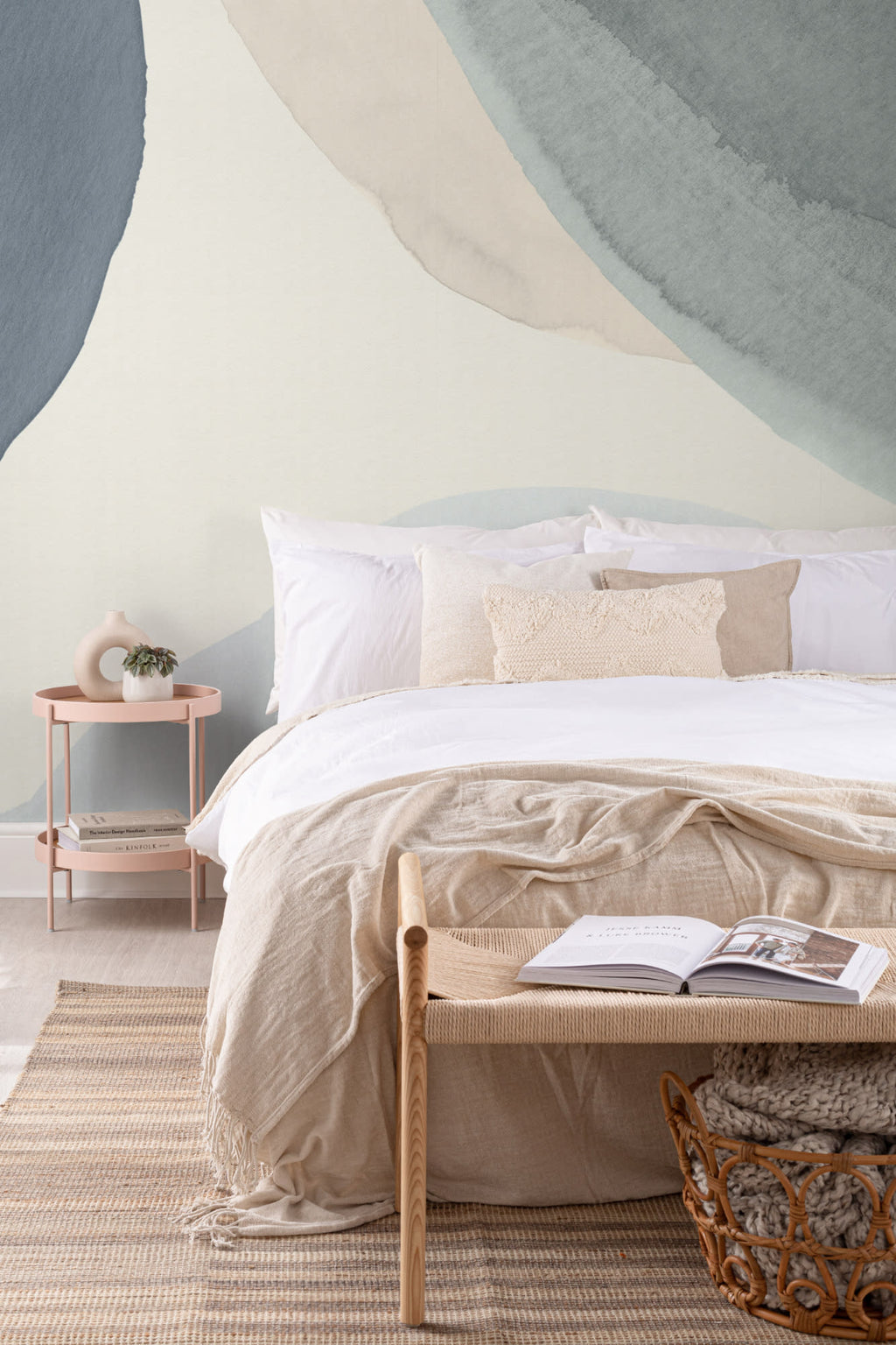 The Pebble Wash mural in denim and sand behind the bed in a bedroom