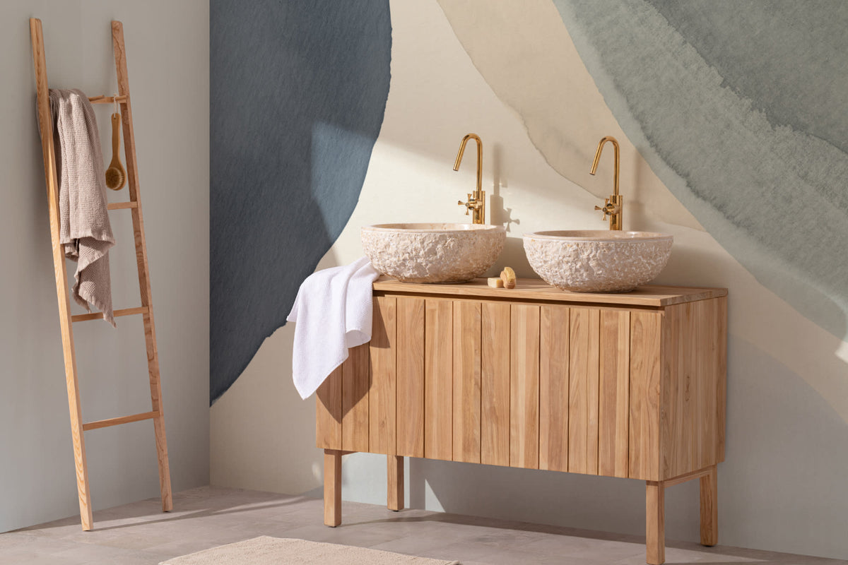 The Pebble Wash mural in denim and sand behind a styled console