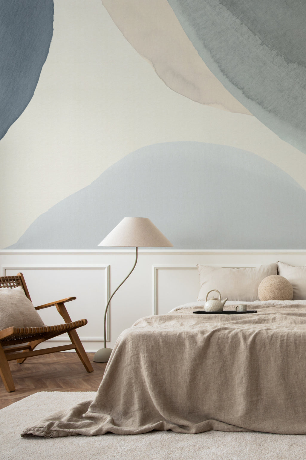 The Pebble Wash mural in denim and sand in a calm bedroom setting