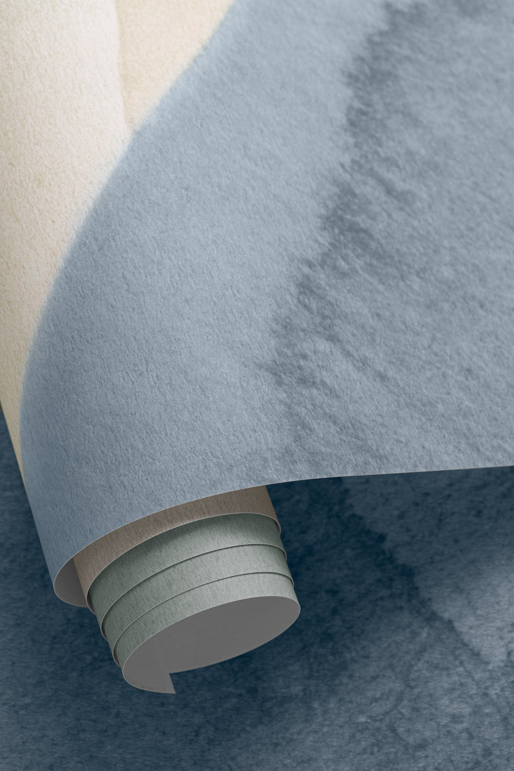 Angled detail of The Pebble Wash mural in denim and sand