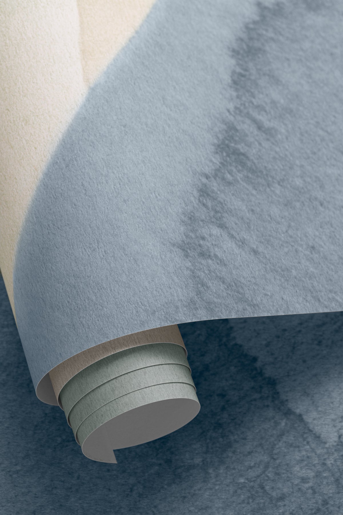 Angled detail of The Pebble Wash mural in denim and sand