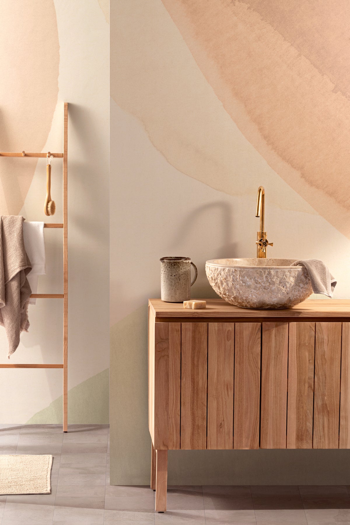 The Pebble Wash mural in peach and sage in a styled vignette
