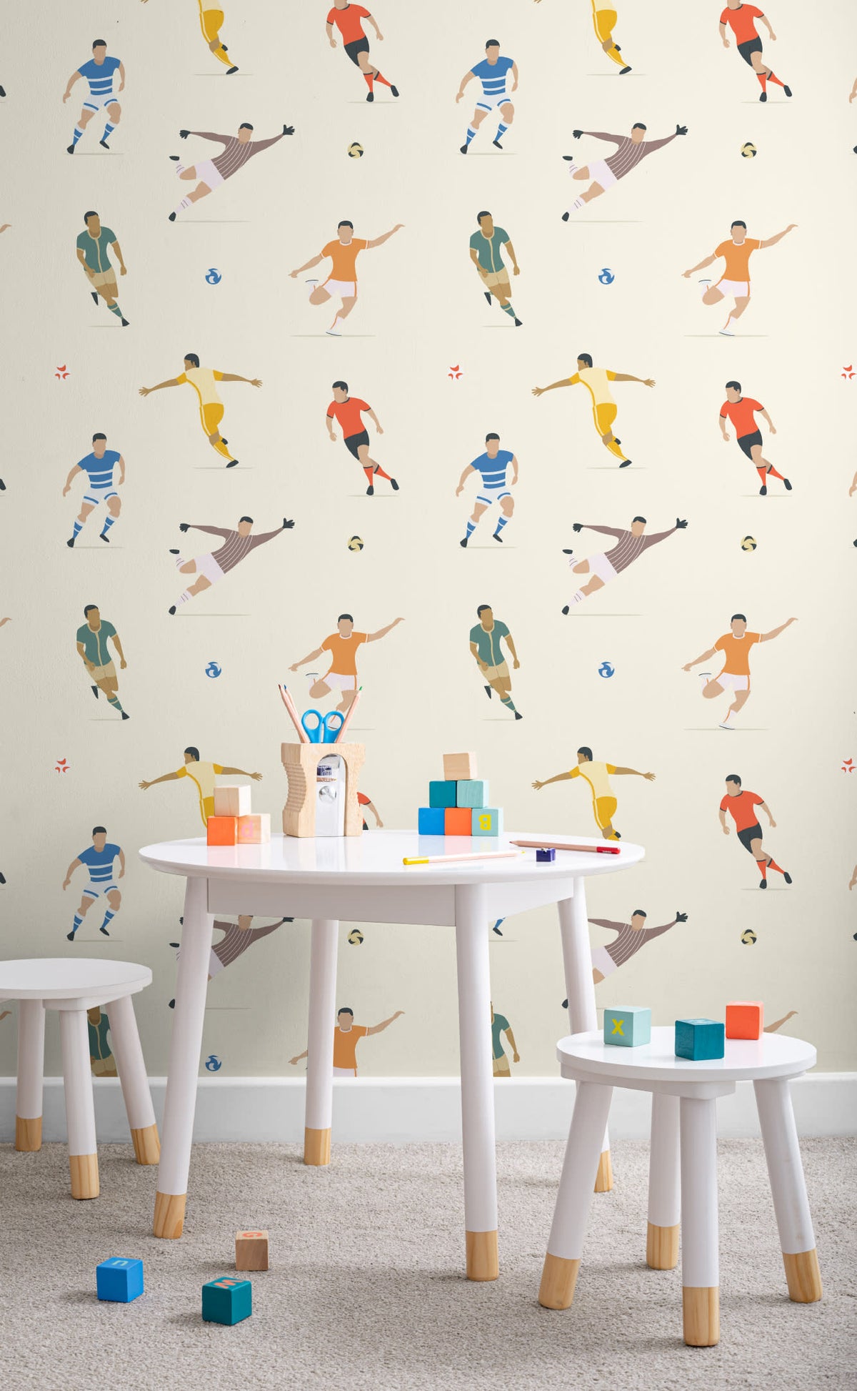 The Pitchside Club wallpaper in warm cream in a child's bedroom