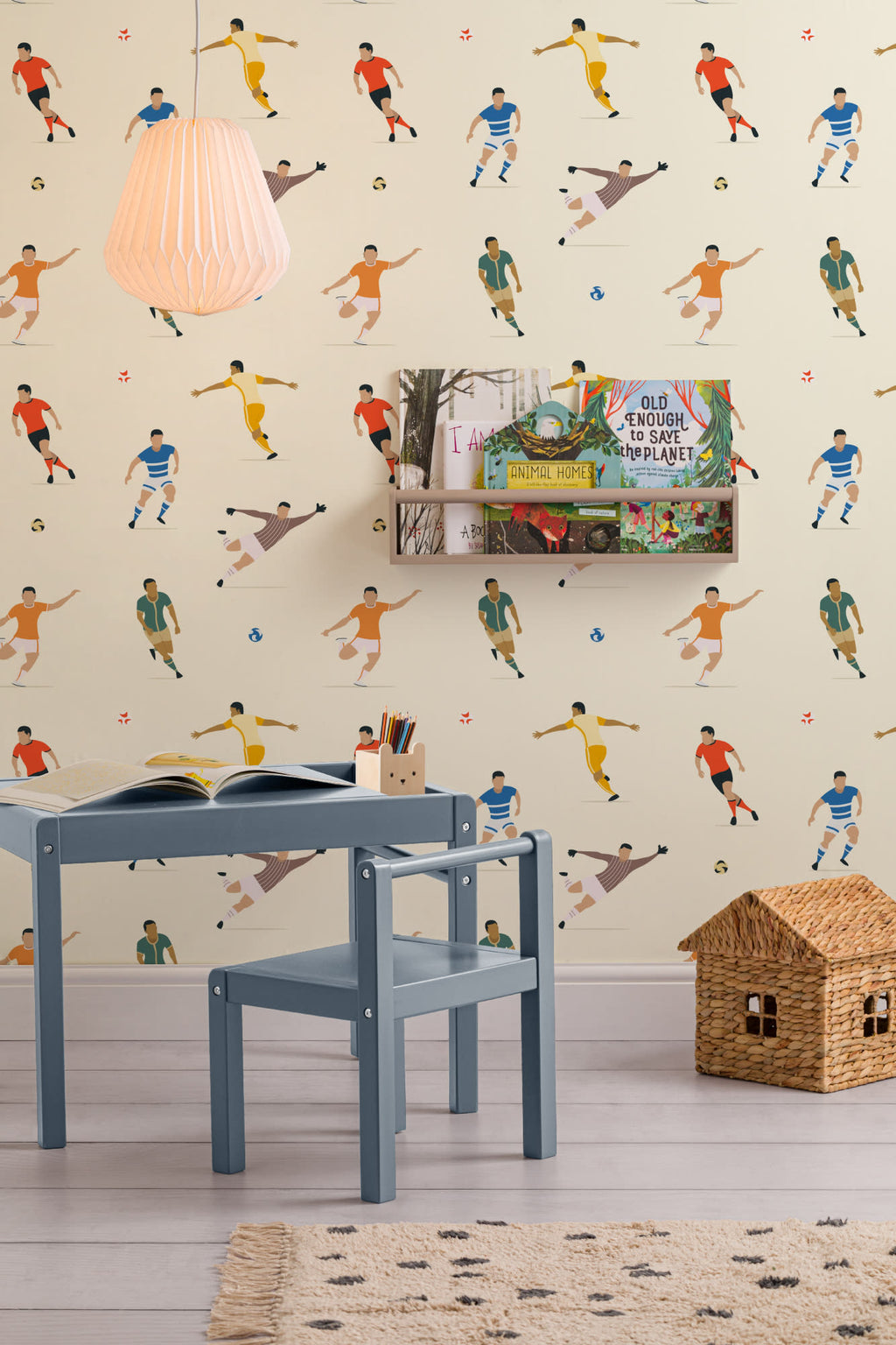 The Pitchside Club wallpaper in warm cream in a children's room setting