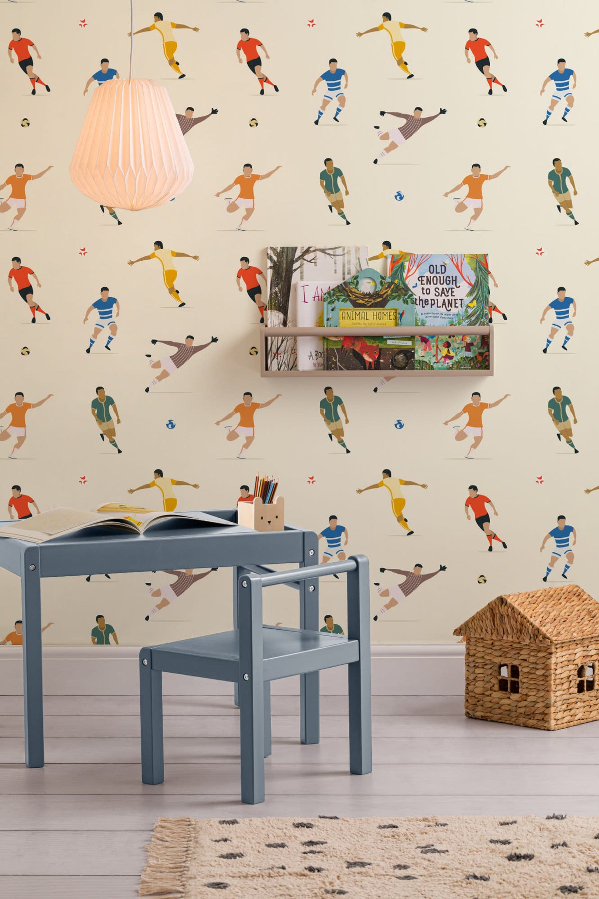 The Pitchside Club wallpaper in warm cream in a children's room setting
