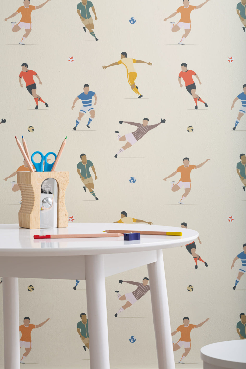 The Pitchside Club wallpaper in warm cream in a children's room setting, view 3
