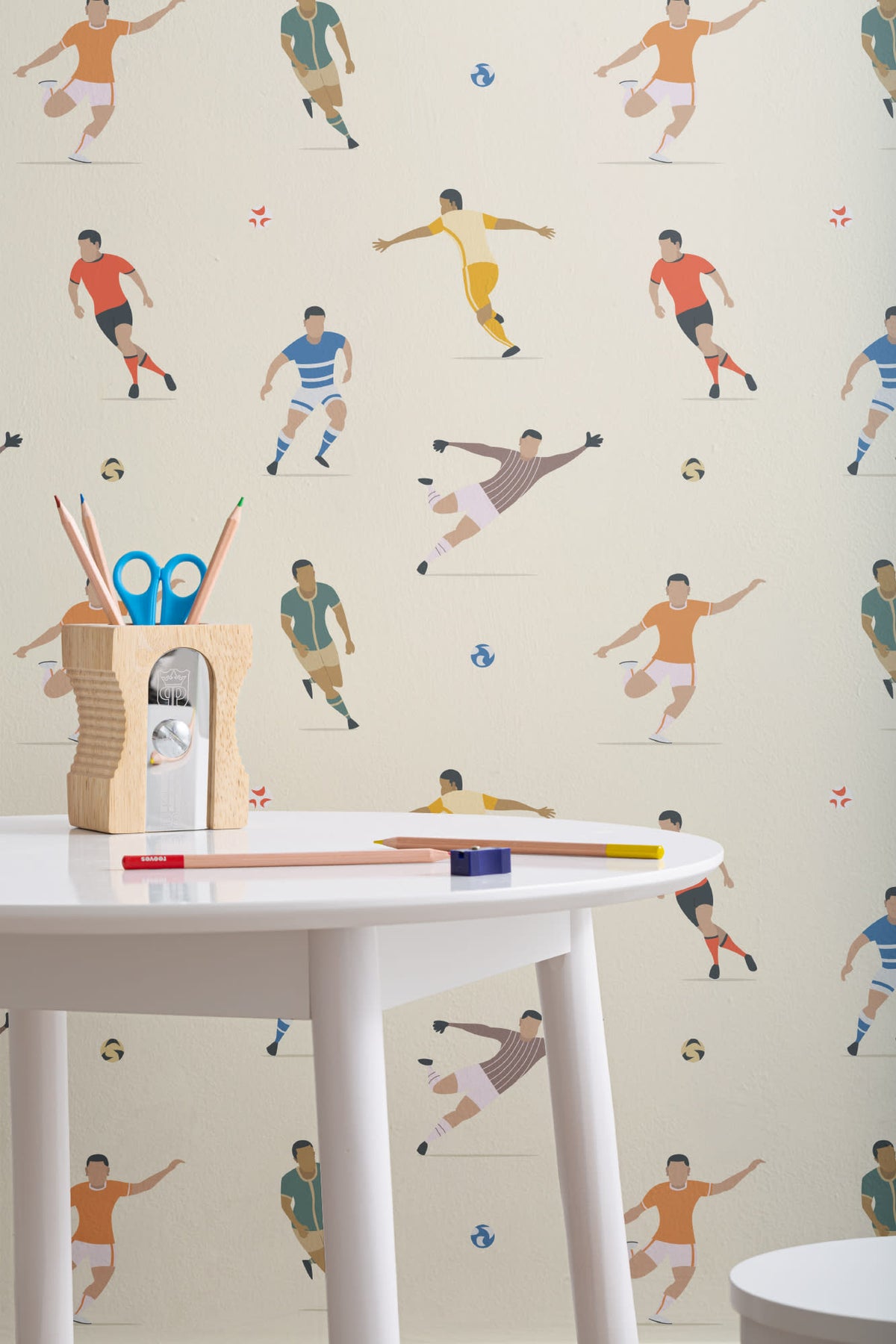 The Pitchside Club wallpaper in warm cream in a children's room setting, view 3