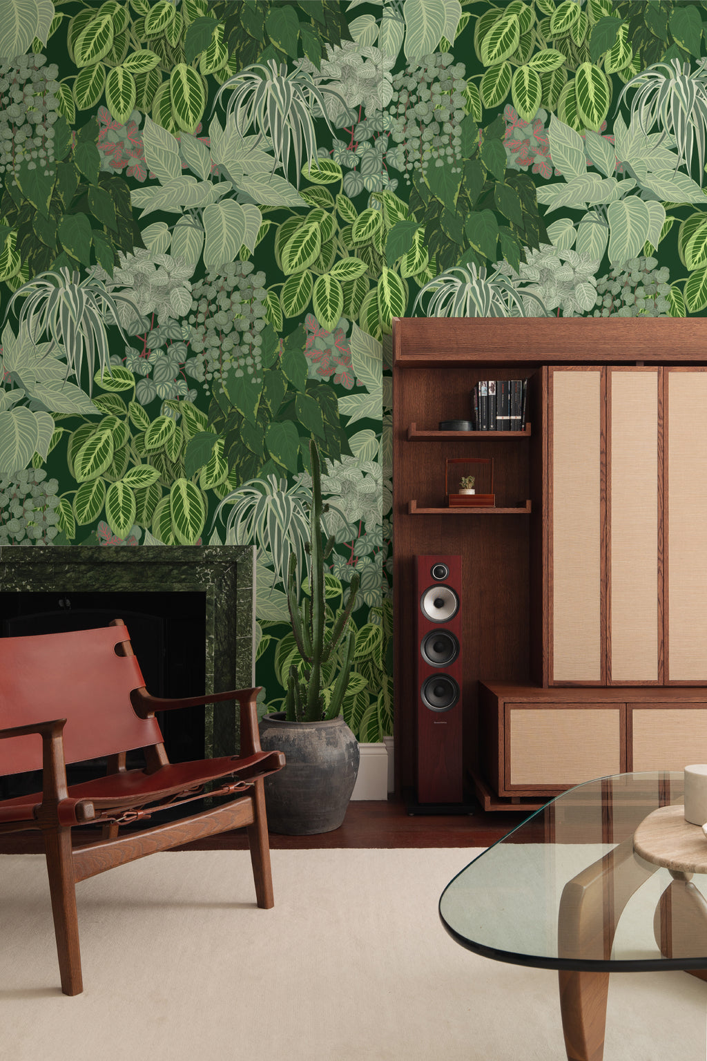The Plant Room wallpaper in deep green behind seating in a living room