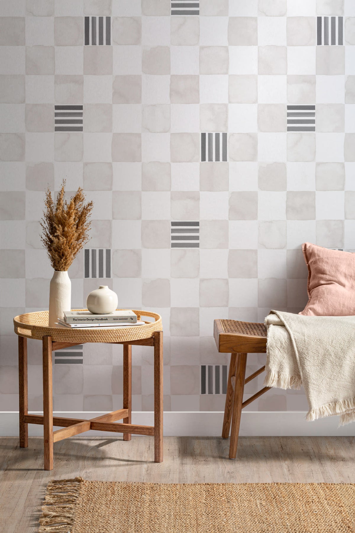 The Plaster Chequer wallpaper in soft greige in a study corner with a desk