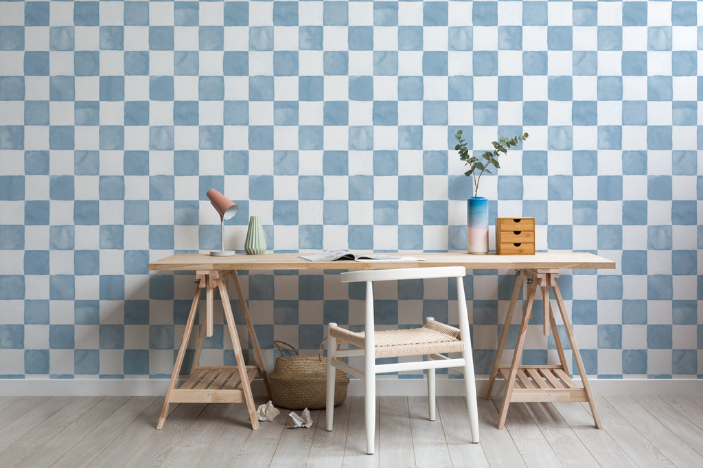 The Poolside Check mural in pool blue behind a desk in a home office