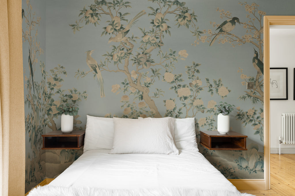 The Porcelain Screen mural in duck egg and stone behind the bed in a bedroom