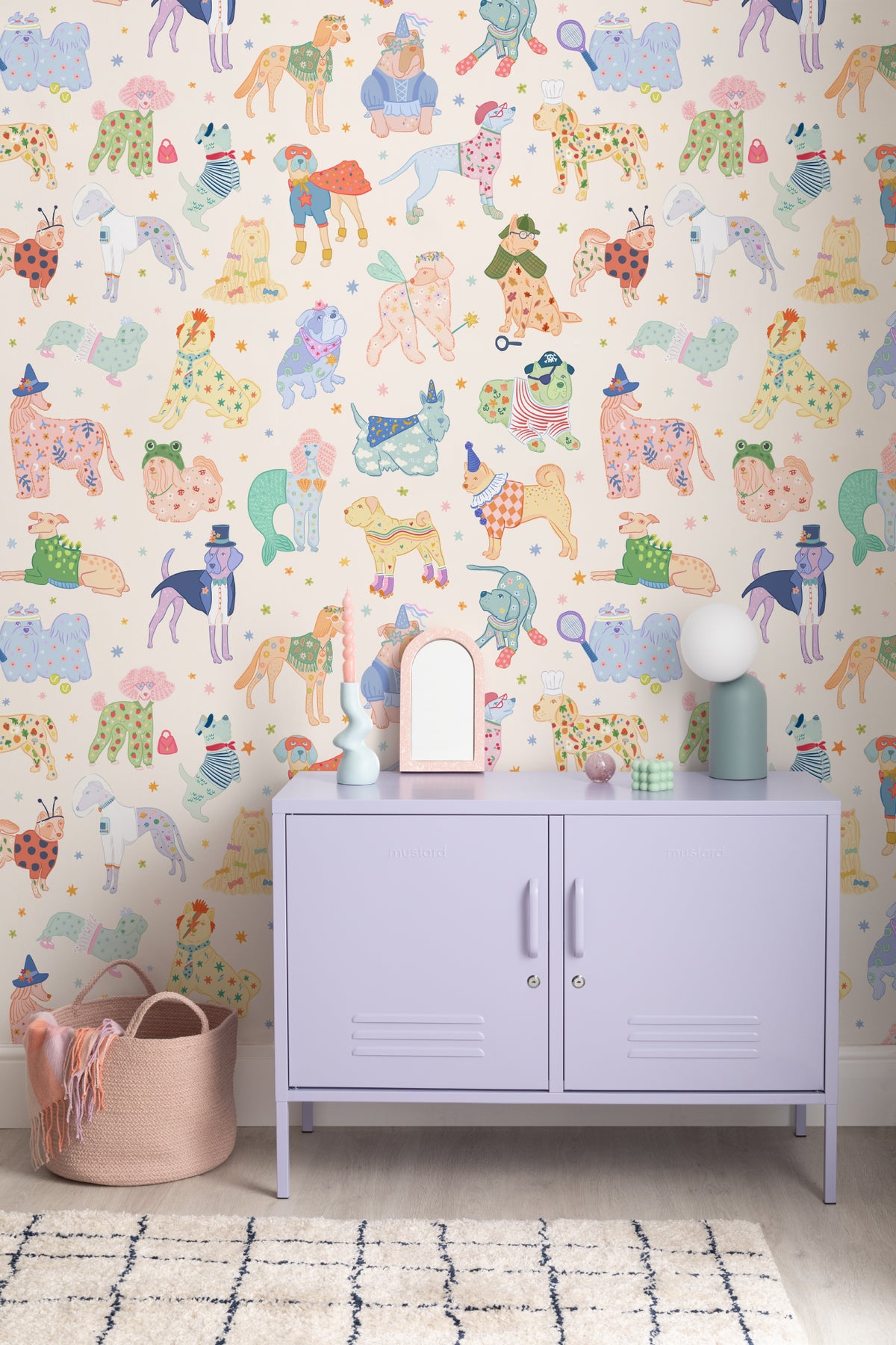 The Pup Carnival mural in sunny blue and yellow on a nursery wall