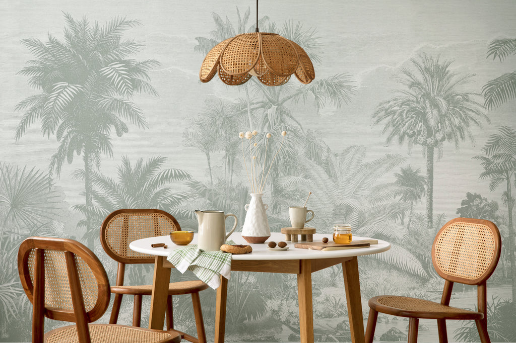 The Rainforest Etching mural in sage and stone behind a dining table