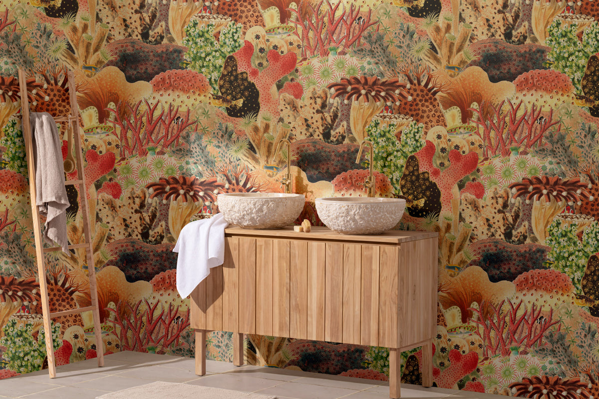 The Reef Cabinet mural in coral red and jade behind a styled console