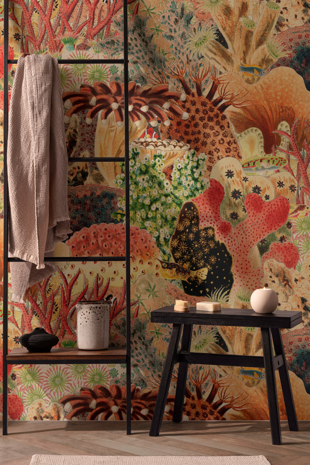 The Reef Cabinet mural in coral red and jade in a living room