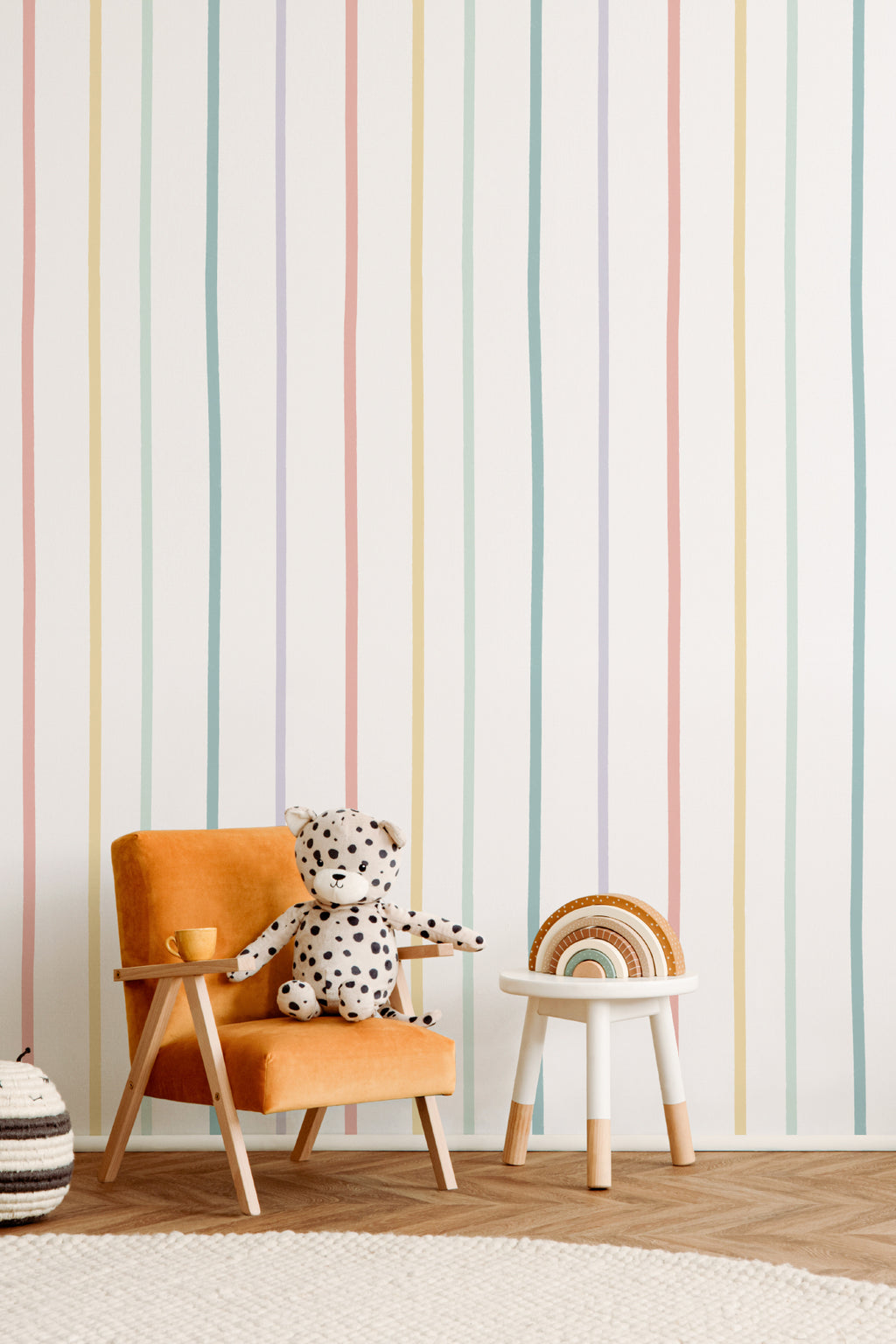 The Ribbon Lane wallpaper in sorbet pastel in a children's room setting, another angle