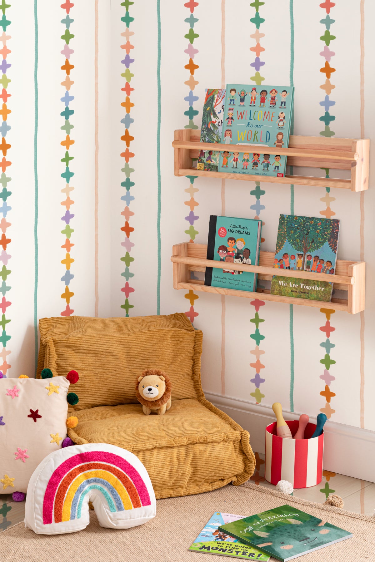 The Ribbon Maypole wallpaper in sage and sherbet in a children's room setting