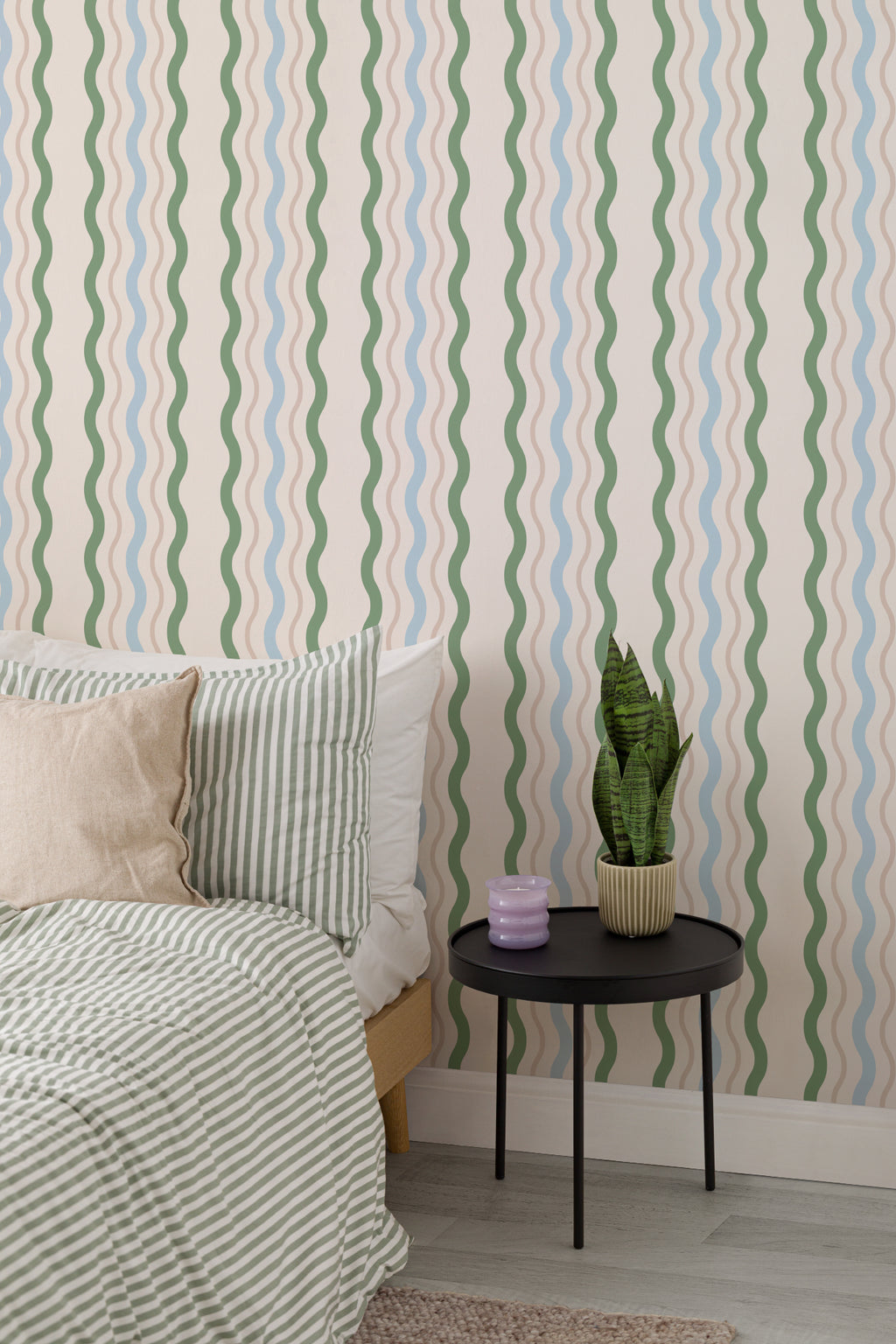 The Ripple Trim wallpaper in sage and sky in a calm bedroom setting