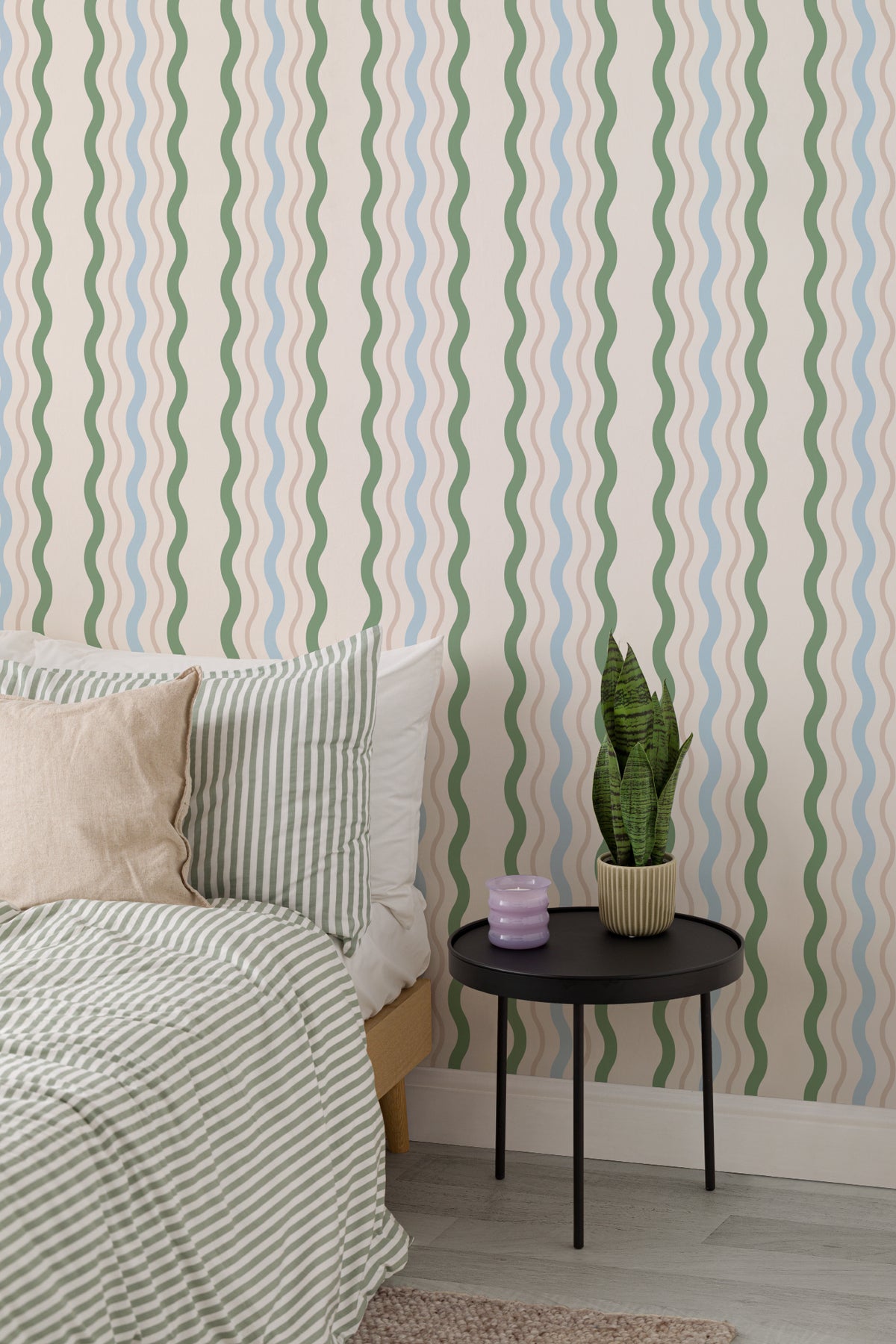 The Ripple Trim wallpaper in sage and sky in a calm bedroom setting