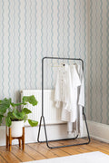The Ripple Trim wallpaper in sky blue in a hallway