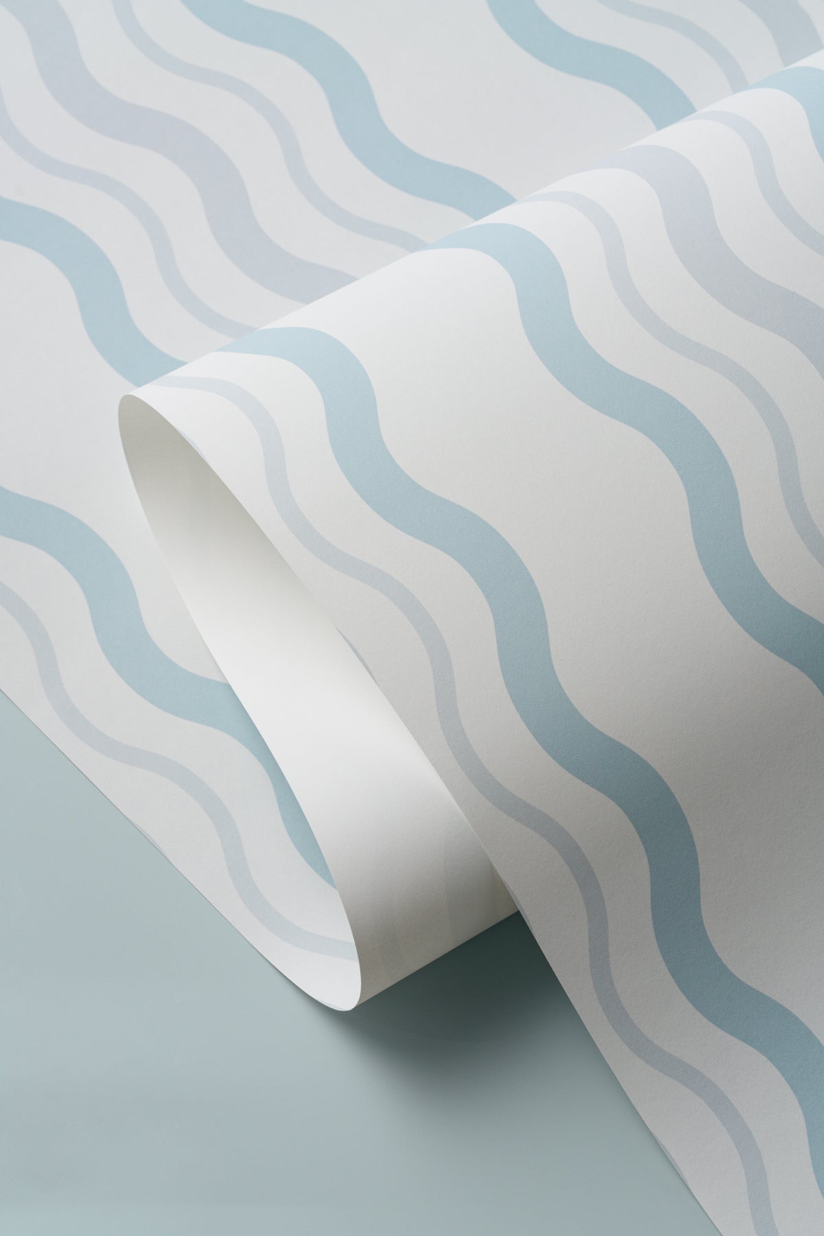 Angled detail of The Ripple Trim wallpaper in sky blue