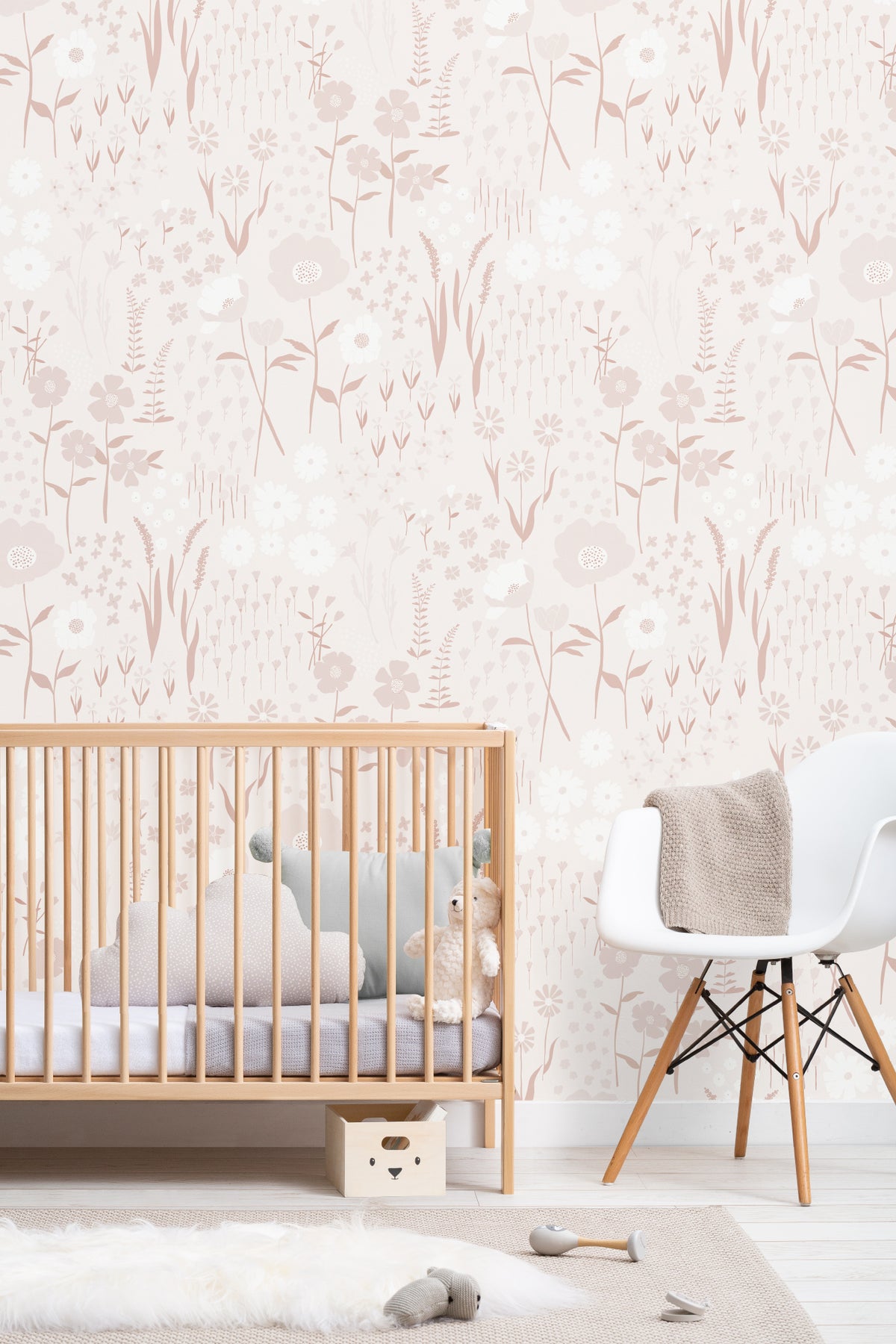 The Rosehip Field wallpaper in dusky pink on a nursery wall