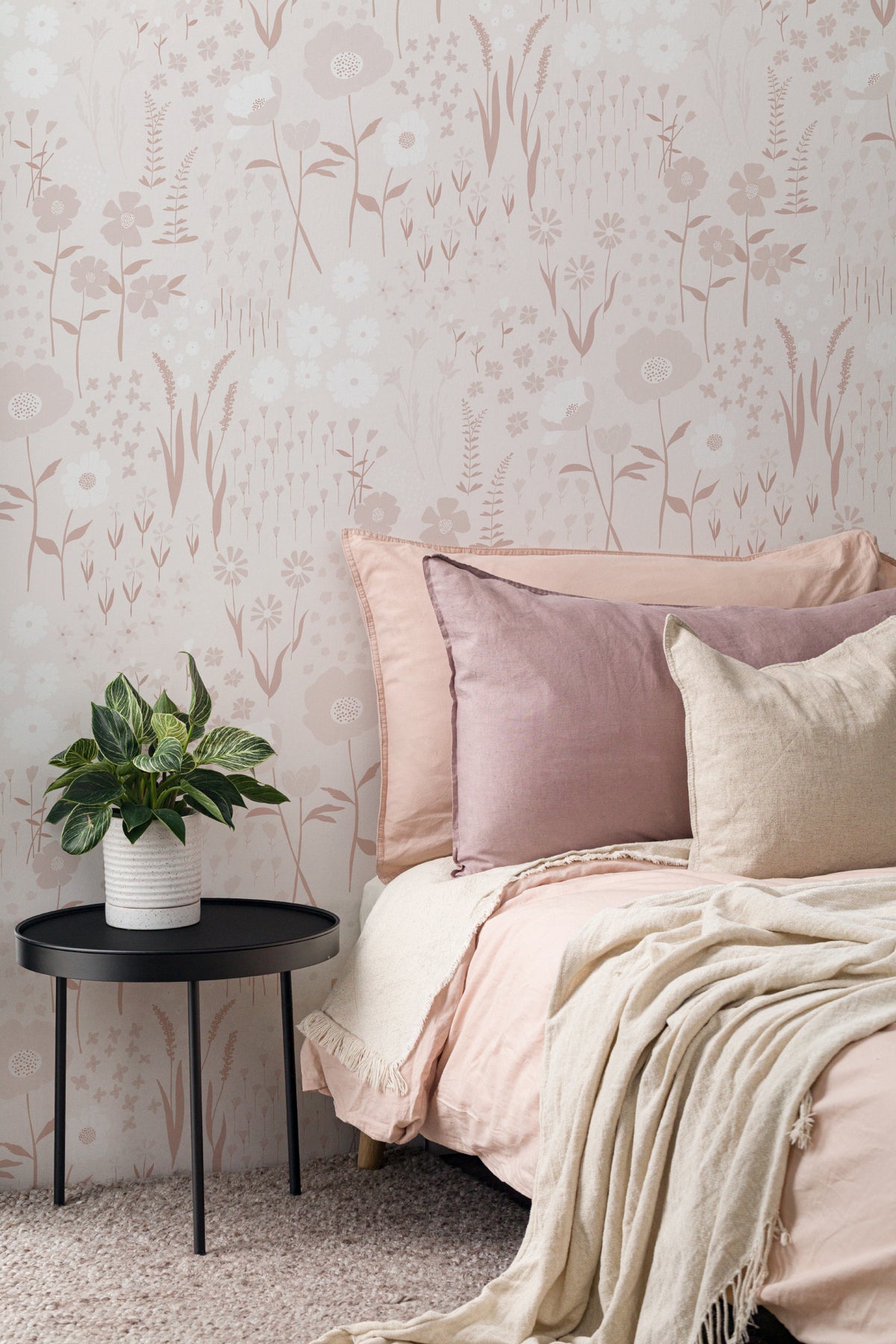 The Rosehip Field wallpaper in dusky pink in a living room