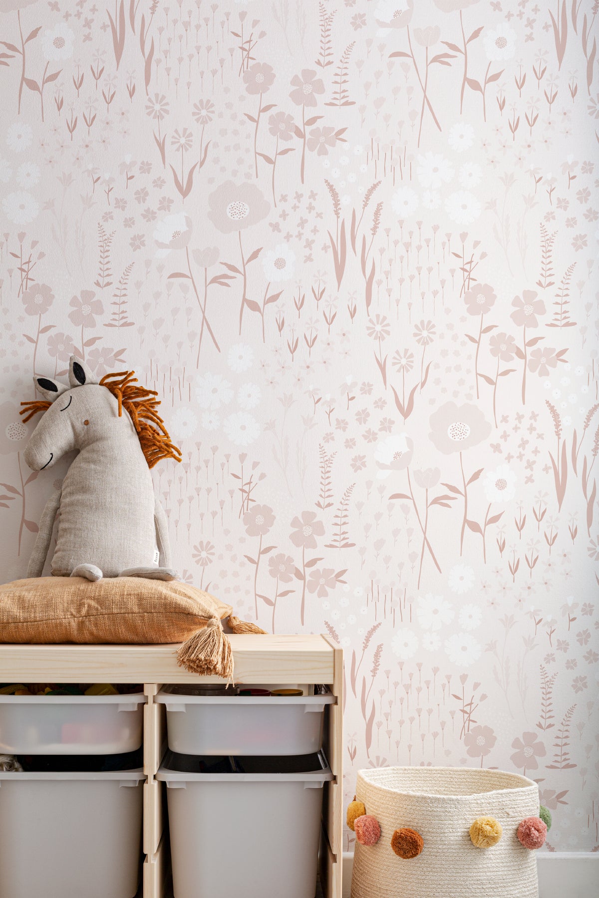 The Rosehip Field wallpaper in dusky pink behind a styled console