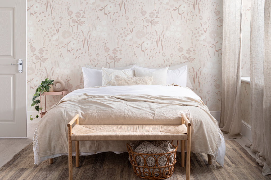 The Rosehip Field wallpaper in dusky pink in a calm bedroom setting