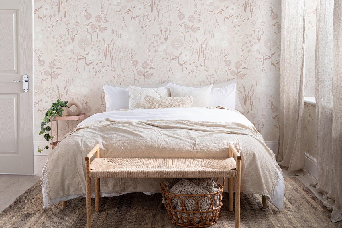 The Rosehip Field wallpaper in dusky pink in a calm bedroom setting