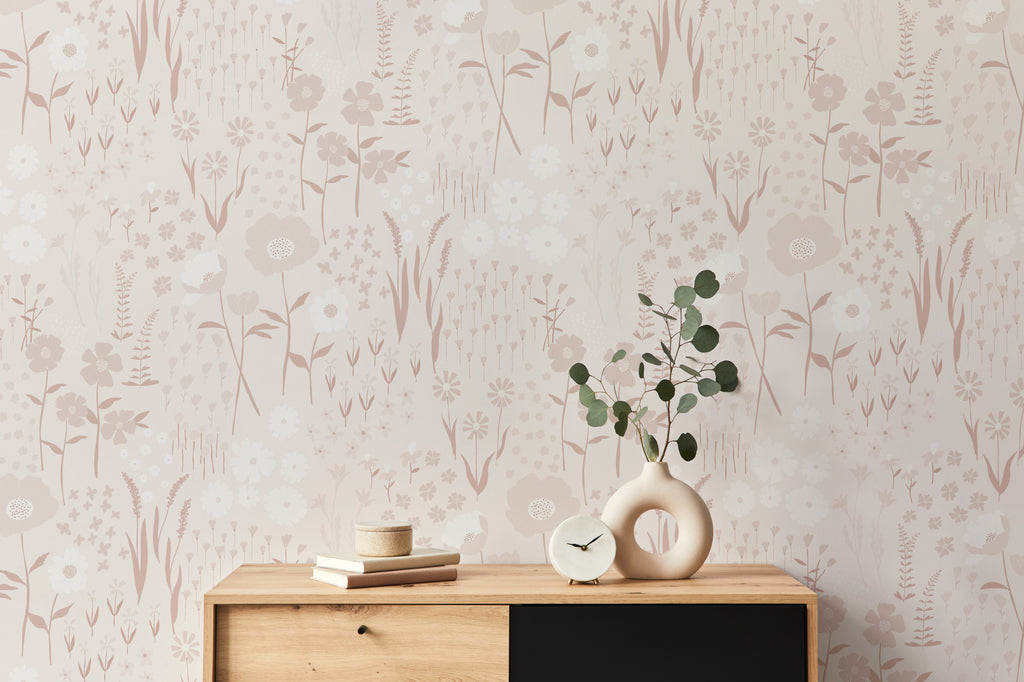 The Rosehip Field wallpaper in dusky pink as a backdrop to styled furniture