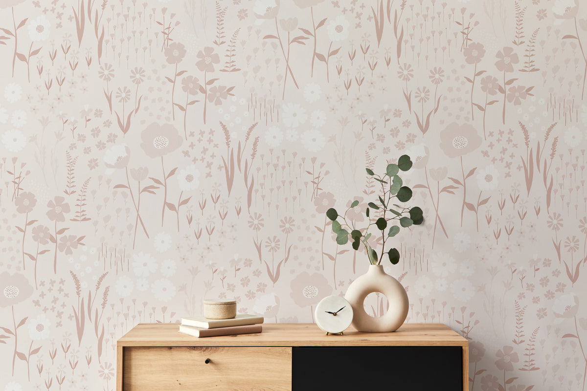 The Rosehip Field wallpaper in dusky pink as a backdrop to styled furniture