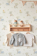 The Savanna Parade wallpaper in pastel neutral on a nursery wall