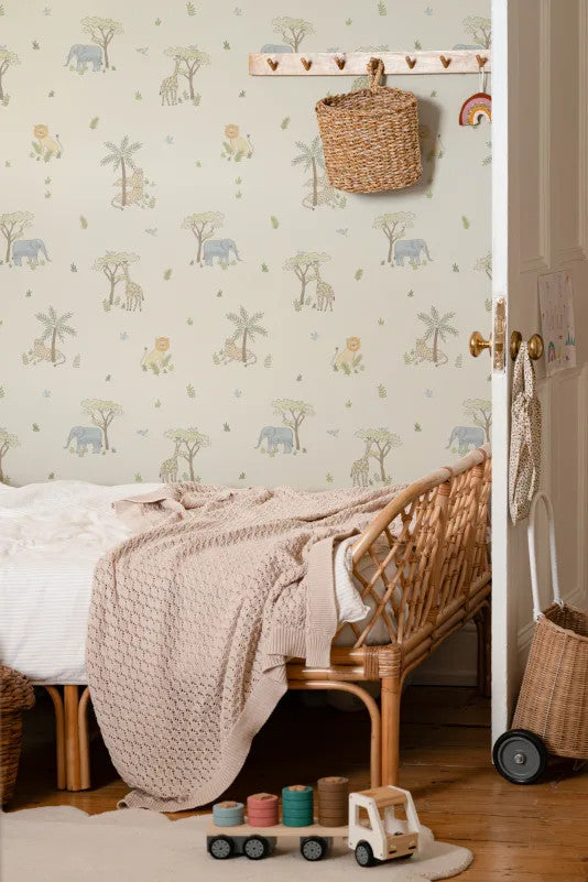 The Savanna Parade wallpaper in pastel neutral in a children's room setting