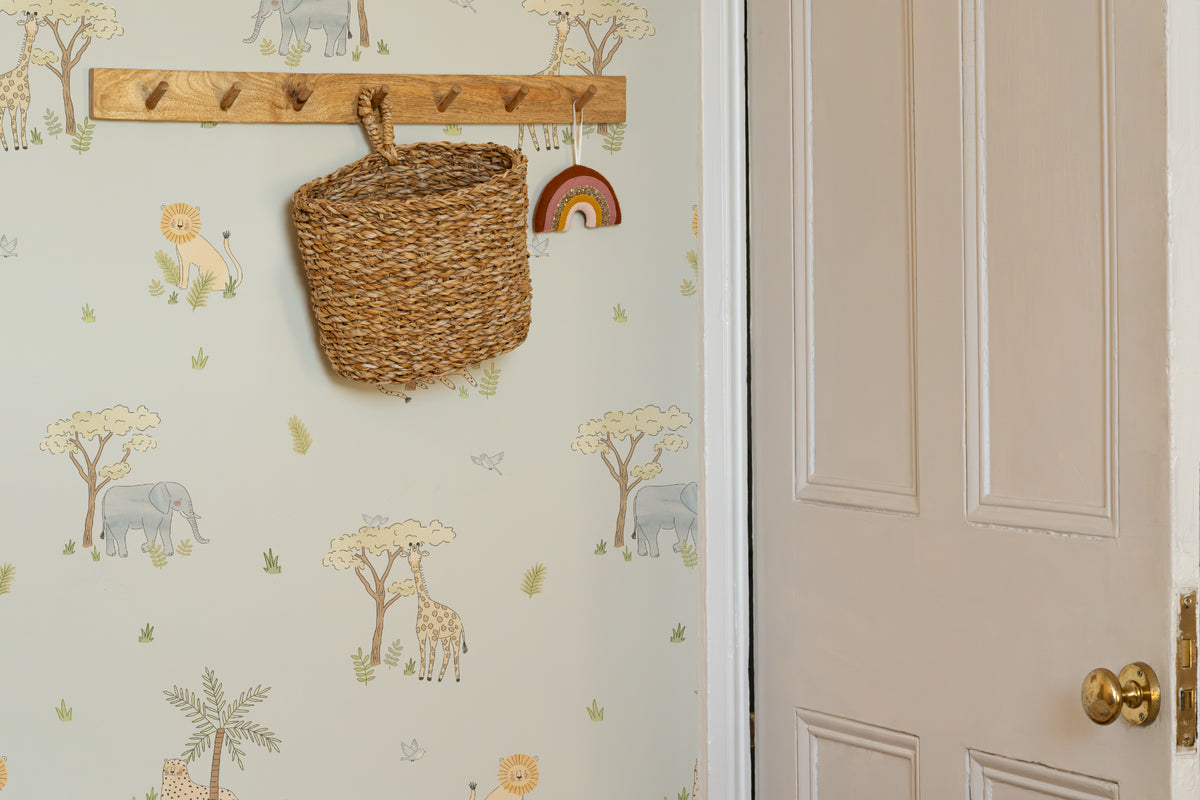 The Savanna Parade wallpaper in powder blue in a hallway
