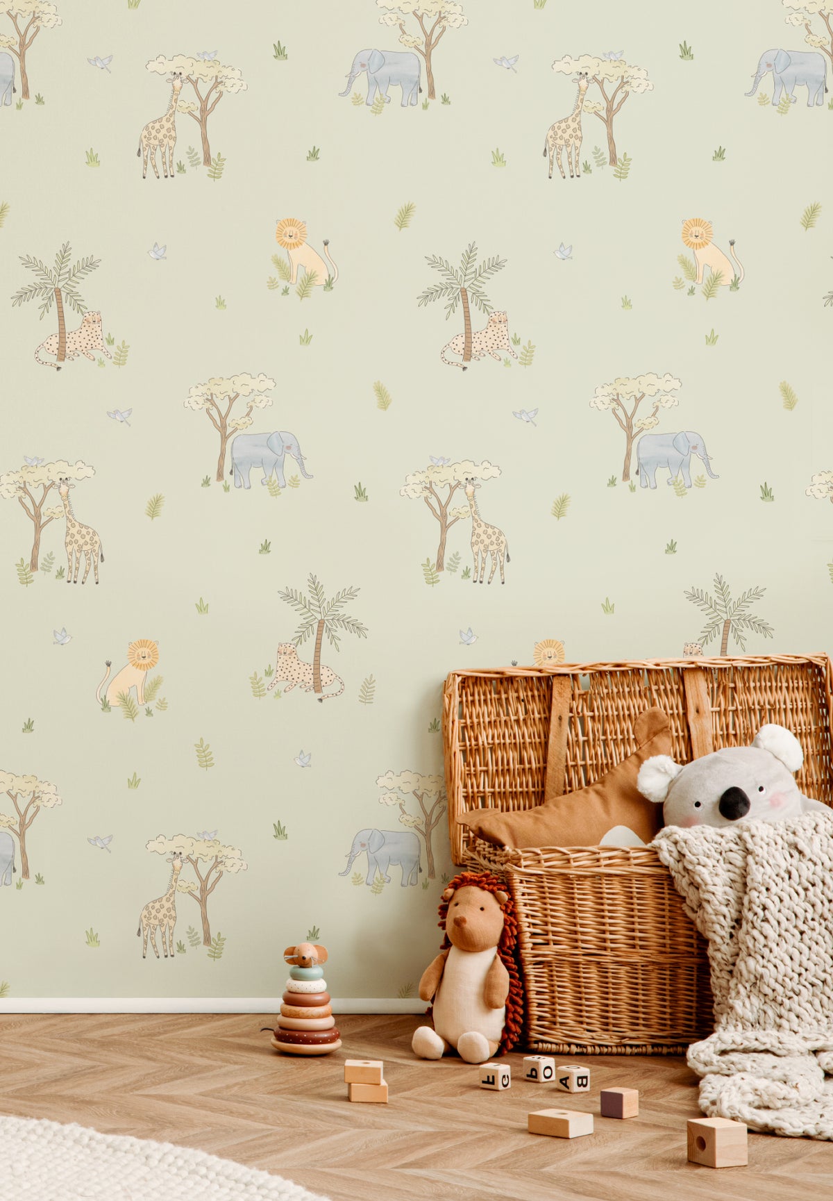 The Savanna Parade wallpaper in soft sage on a nursery wall